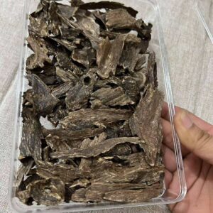 Alphaa Manipur premium Agarwood (Oud) showing natural dark resin wood grains and aromatic texture.